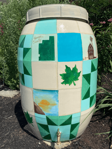 Photo of rain barrel painted like a quilt.